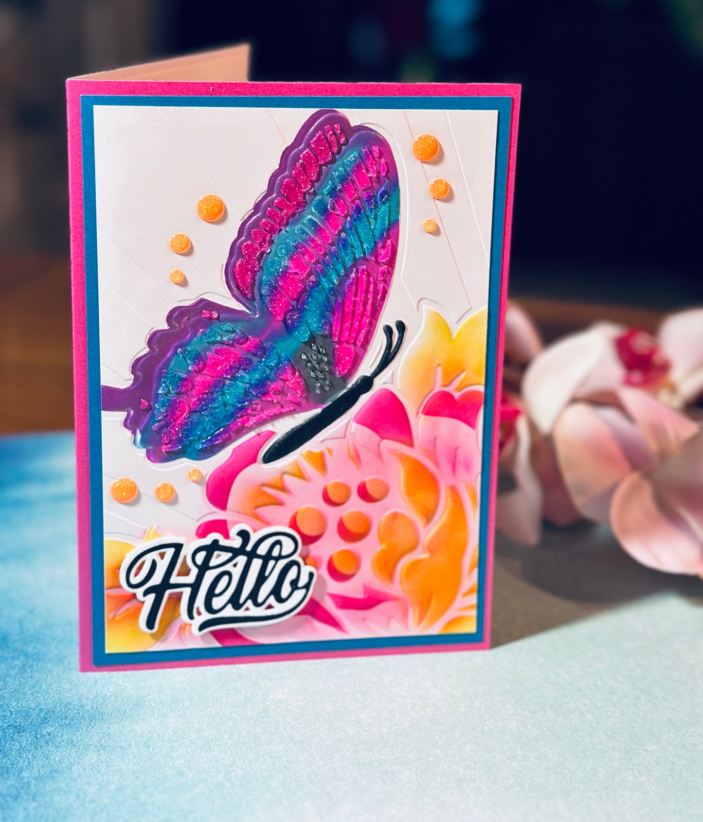 5x7 Embossed card with large stencil pasted, pink, blue and purple butterfly.