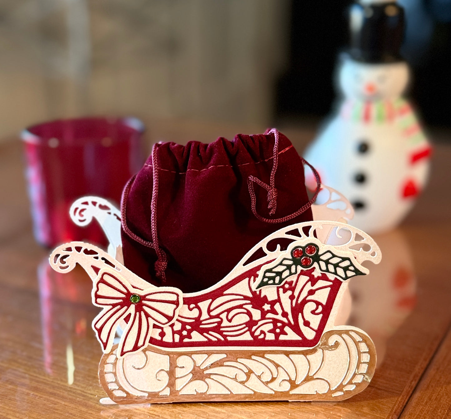 Christmas sleigh box with detached velvet bag for gifts.