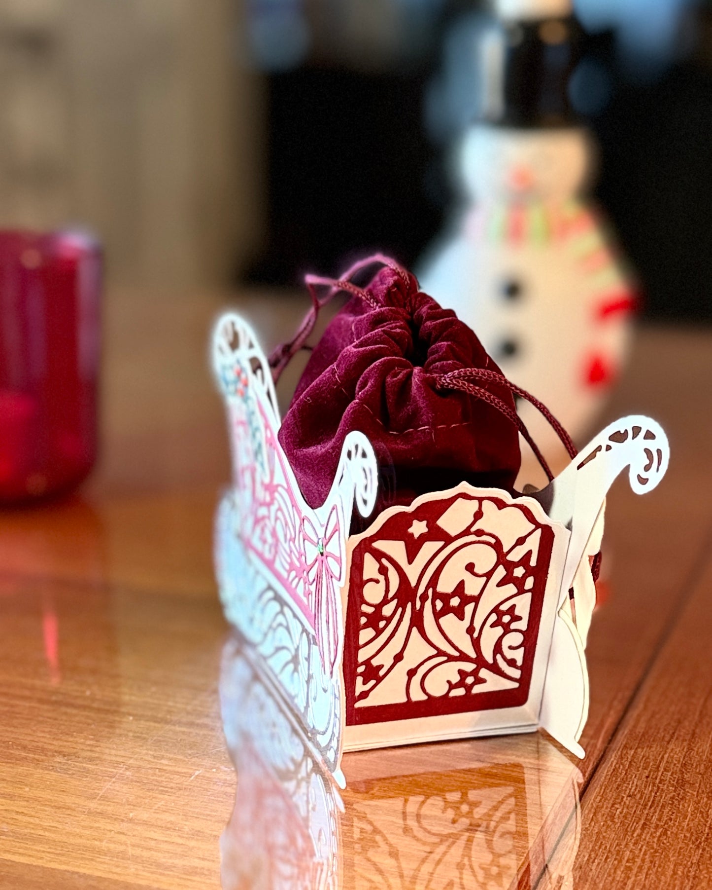 Christmas sleigh box with detached velvet bag for gifts.