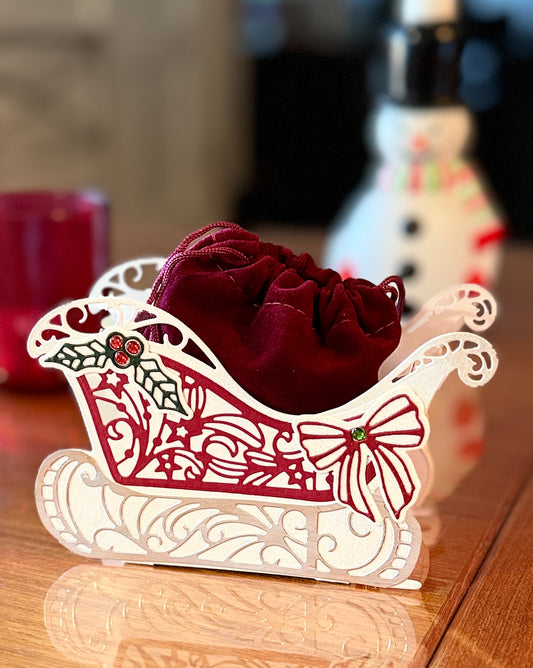 Christmas sleigh box with detached velvet bag for gifts.