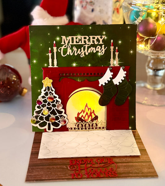 Flickering Fireplace card with green stockings