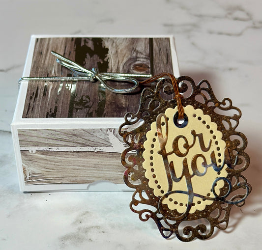 Wood themed box of four chocolates in graduation caps