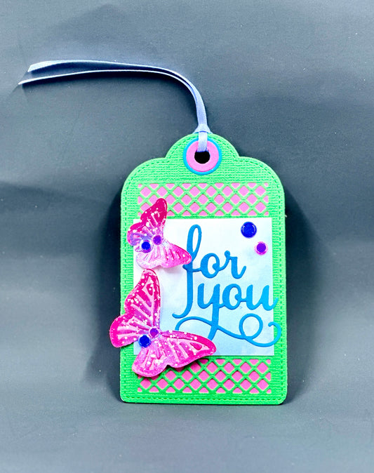 Cute and colorful hand-made gift tag featuring two embossed and brighlty painted butterflies.